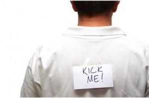 false guilt - man with kick me written on his back