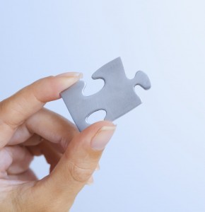 values - represented by hand holding piece of jigsaw puzzle