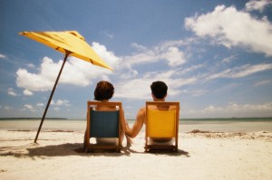 How to have a great summer - shown by couple holding hands at the beach