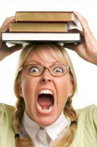 Attractive Woman with Her Books Isolated on a White Background.